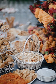 Vertical shot of wedding candy bar with nuts and pastry