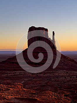 Vertical shot of West Mitten Butte in Monument Valley at sunset. Utah, United States.