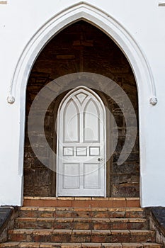 Vertical shot of a white door