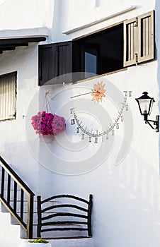 Vertical shot of the white painted walls of Binibeca Vell in Islas Baleares, Spain