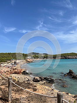 Vertical shot of a wild beach on a sunny day,  Es Canar, Ibiza photo