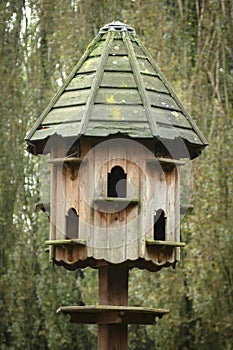 Vertical shot of a wooden dovecote