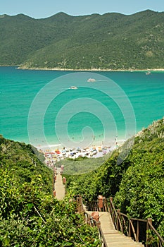 Vertical shot of Wooden stairs leading to Atalaya beach in Arraial do Cabo, Rio de Janeiro State