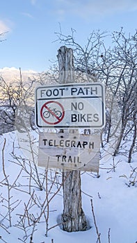 Vertical Signages at the Telegraph Trail of Wasatch Mountains buried in snow in winter