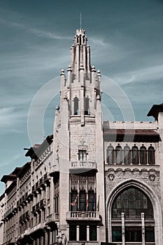 Vertical of a skyline of a gothic architectural building at Vie Laietana street in Barcelona photo