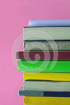 Vertical stack of colorful books. Copy space