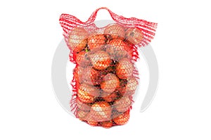 Vertical standing string bag of bright onions