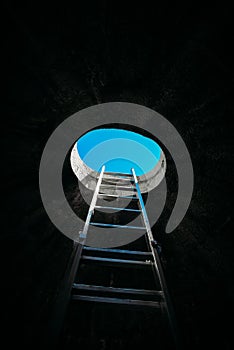 Vertical step ladder on ceiling window leading to freedom and other positive emotions