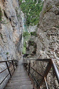 Vertical steps leading a tourist to the bottom of canyon Verdon