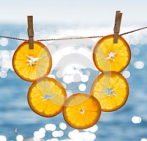 Vertical still life with oranges and sea in the background