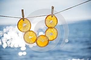 Vertical still life with oranges and sea in the background