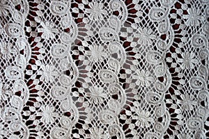 Vertical stripes of white lacy fabric