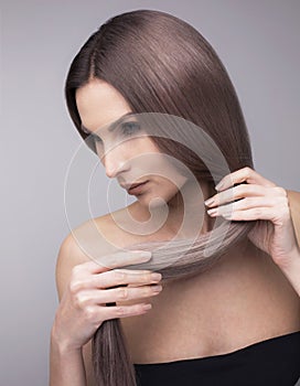 Vertical studio shot of a woman with strong long purple hair
