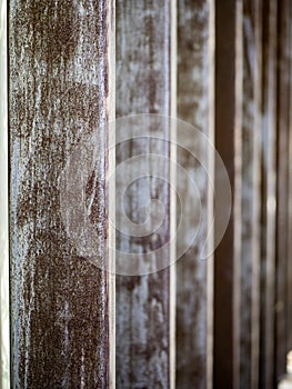 Vertical: Textured, metal slats on modern building for digital background