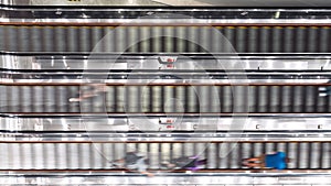 Vertical time-lapse of Asian people transport on escalator at subway underground station in Hong Kong