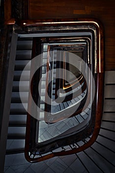 Vertical top view shot of a spiraling staircase