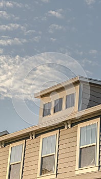 Vertical Upper storey of a house with large sash windows