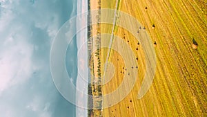 Vertical, Vertical Shot, Timelapse Time lapse Dronelapse Hyperlapse. Aerial View Of Haystacks In Agricultural Field