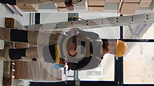 Vertical video Chief officer preparing warehouse orders