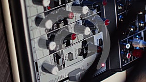 Vertical video Close up shot of professional analog mixer able to produce impeccable sound