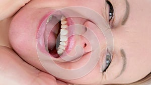 vertical video different cheerful positive emotions of a girl a woman put 2 hands to her face opened her mouth laughing