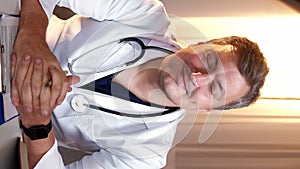 Vertical video doctor consultation man uniform