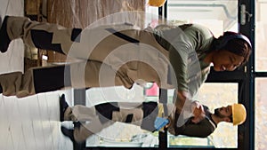 Vertical video Employee dancing in warehouse