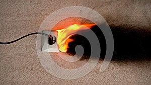 Vertical video. Fire caused by short circuit. The concept of a fire in the house