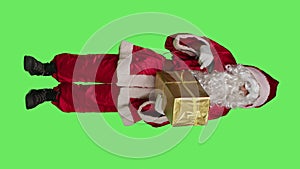 Vertical video Front view of saint nick in suit scanning present box