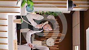 Vertical Video Hotel staff answers calls at reception