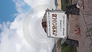 Vertical Video Jerome Arizona Sign with Timelapse Clouds Medium Shot