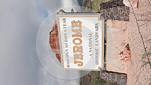 Vertical Video Jerome Arizona Sign with Timelapse Clouds Tight Shot