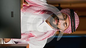 Vertical video Man drinks coffee during job interview