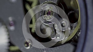 Vertical video Old watch mechanism macro loop. Vintage mechanism working, closeup shot with soft focus. Clock mechanism