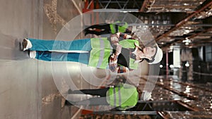 Vertical Video. Warehouse Female Worker in Uniform Engaged in Stocktaking of Product Management in Cardboard Boxes on
