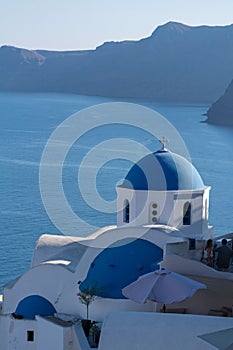 Vertical view of Blue Domed Church Santorini before the sea