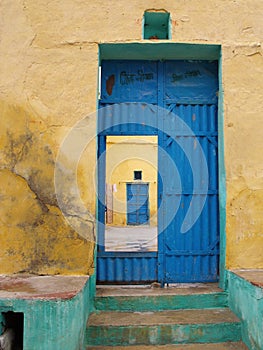 Vertical view of the blue painted front door of a house in Mandawa, Rajasthan, India