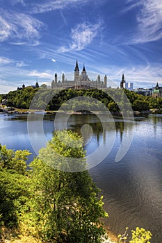 Vertical view of Canada's Parliament by the Ottawa River