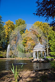 Vertical view of the Chinese pond with autumn trees, in the Jardin del Principe in Aranjuez photo