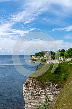 Vertical view of the church at Hojerup on top of the white chalkstone cliffs of Stevns Klint photo