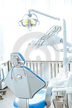 Vertical view of a dentist room with blue seat