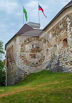 Vertical view of flags at Slovenia`s  Ljubljana castle