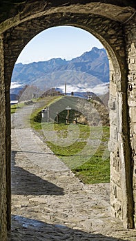 Vertical view of the Garfagnana framed by an arch of the Sanctuary of San Bianco e Pellegrino in San Pellegrino in Alpe, Italy