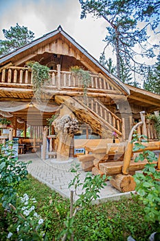 Vertical view of a log cabin at Hija Glamping Lake Bloke in Nova Vas, Slovenia photo