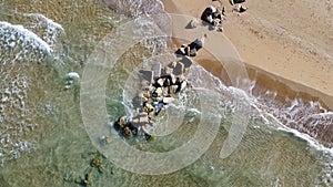 Vertical view of marin breakwater and shallow water