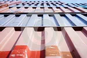 Vertical view of metal surface cargo container stacked in pattern