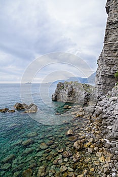 Vertical view of rocky coast. Long exposure shot with beautiful