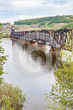 Vertical View of Rusty Railway Bridge Across Fraser River in British Columbia