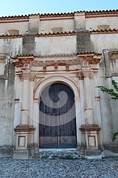 Vertical view. Side door of the Church of San Juan Bautista, 18th century, Linares de la Sierra, Huelva, Spain