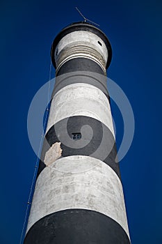 Vertical view of a striped lighthouse in Villa Gesell Partido, Argentina photo